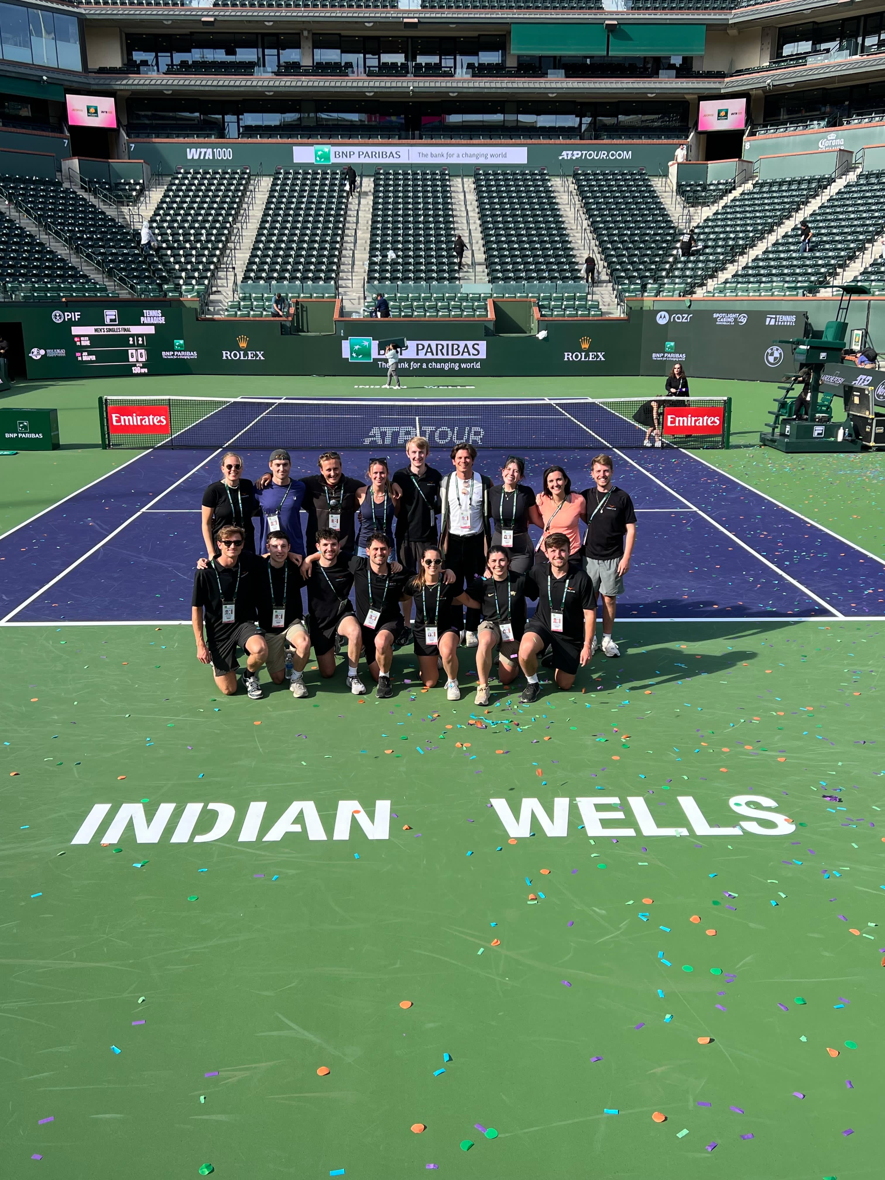 Members of the Hawk-Eye team gather inside Stadium 1 after another job well done in 2026.