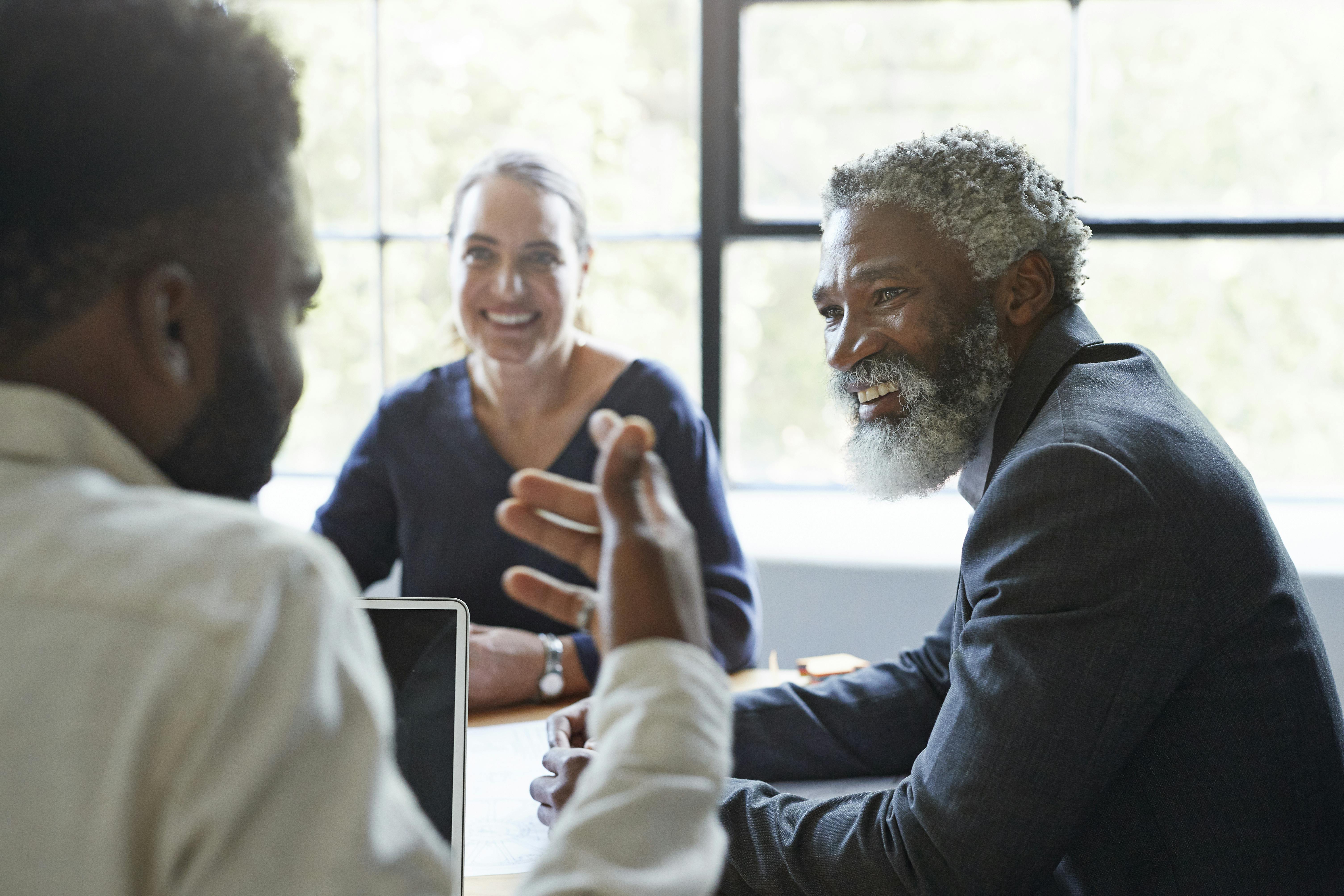 Businessman looking at coworker in an office meeting