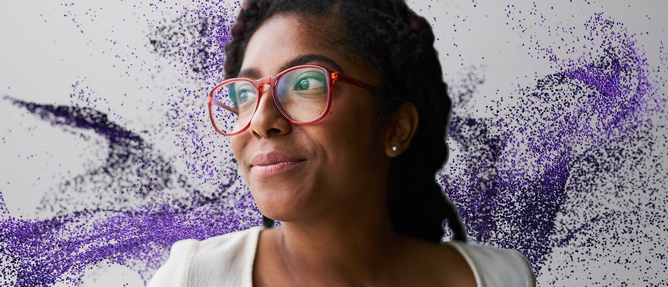 Portrait of a cheerful business woman against a purple particle background