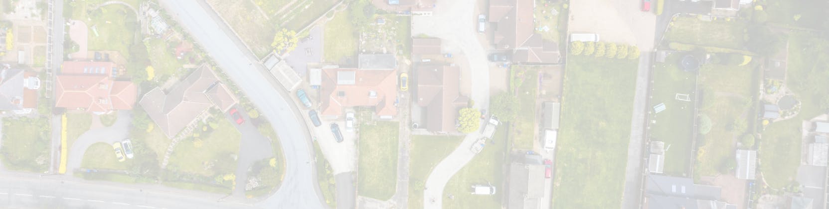 Banner image with a faded aerial view of a suburban neighbourhood.