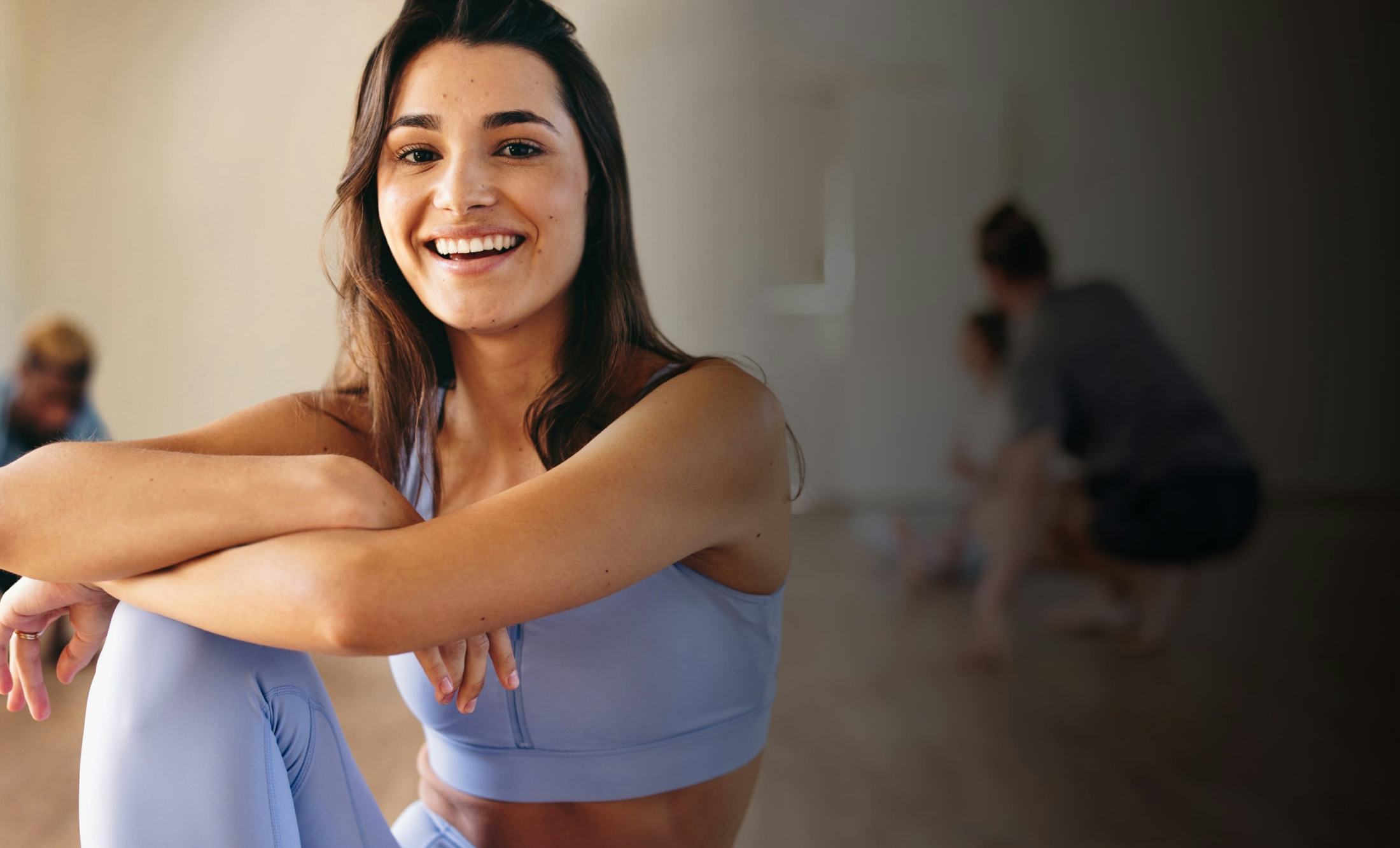 Woman smiling and doing yoga