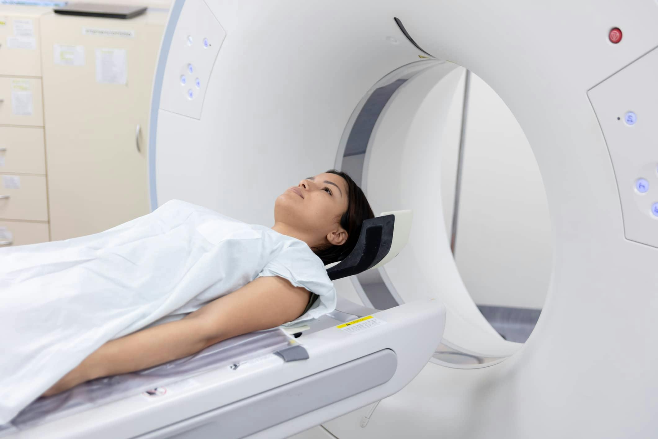 woman laying down about to receive a CAT Scan