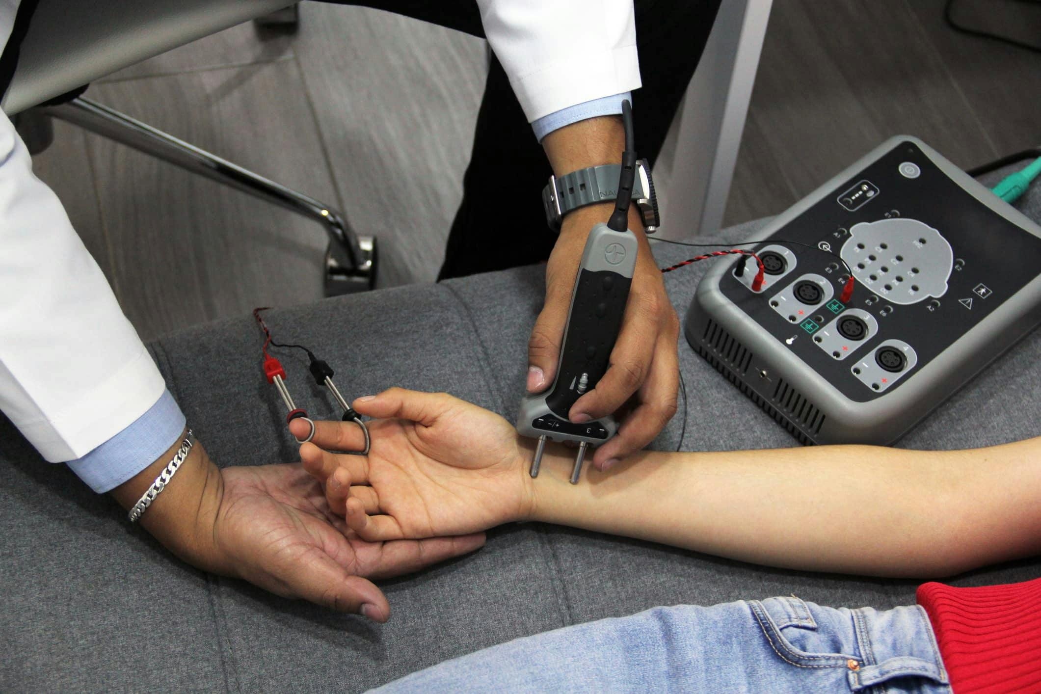 Dr. treating patient with EMG