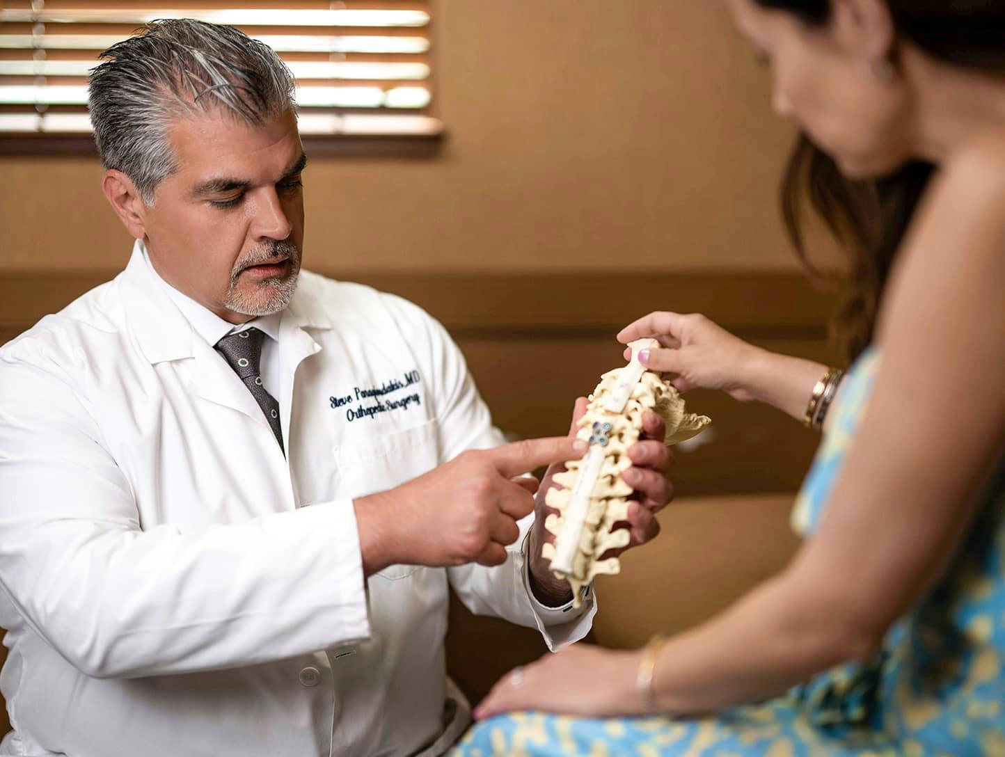Dr. Steve Paragioudakis showing patient anatomy of the spine