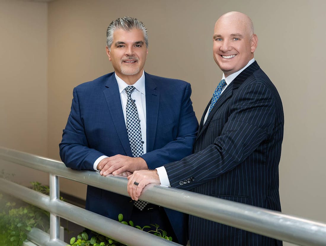 Dr. Paragioudakis & Dr. Menkowitz smiling and standing side by side