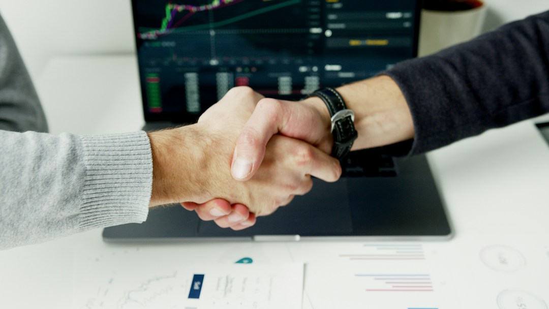 work partners shaking hands