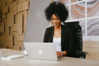 young woman working on laptop