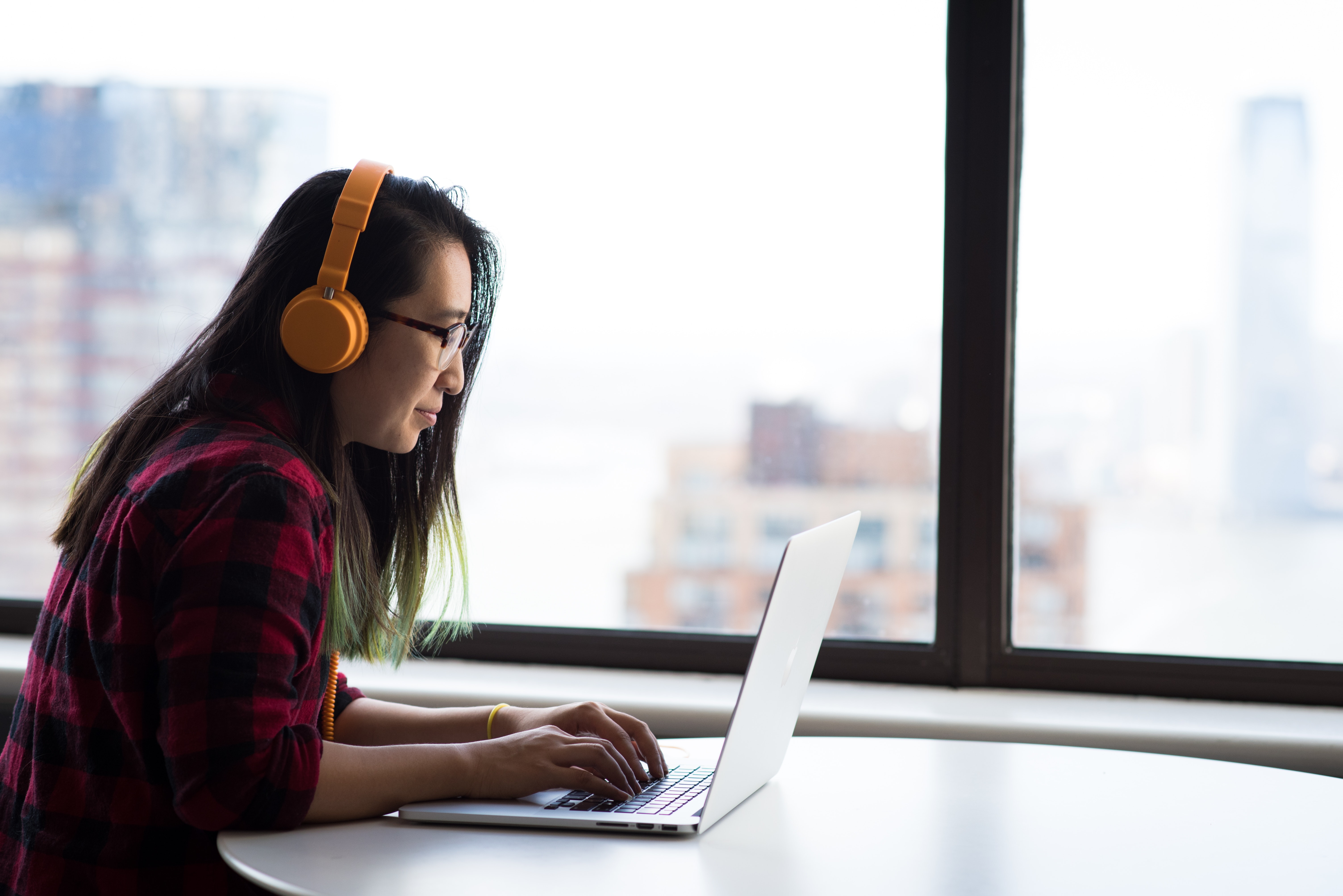 young woman working on a laptop