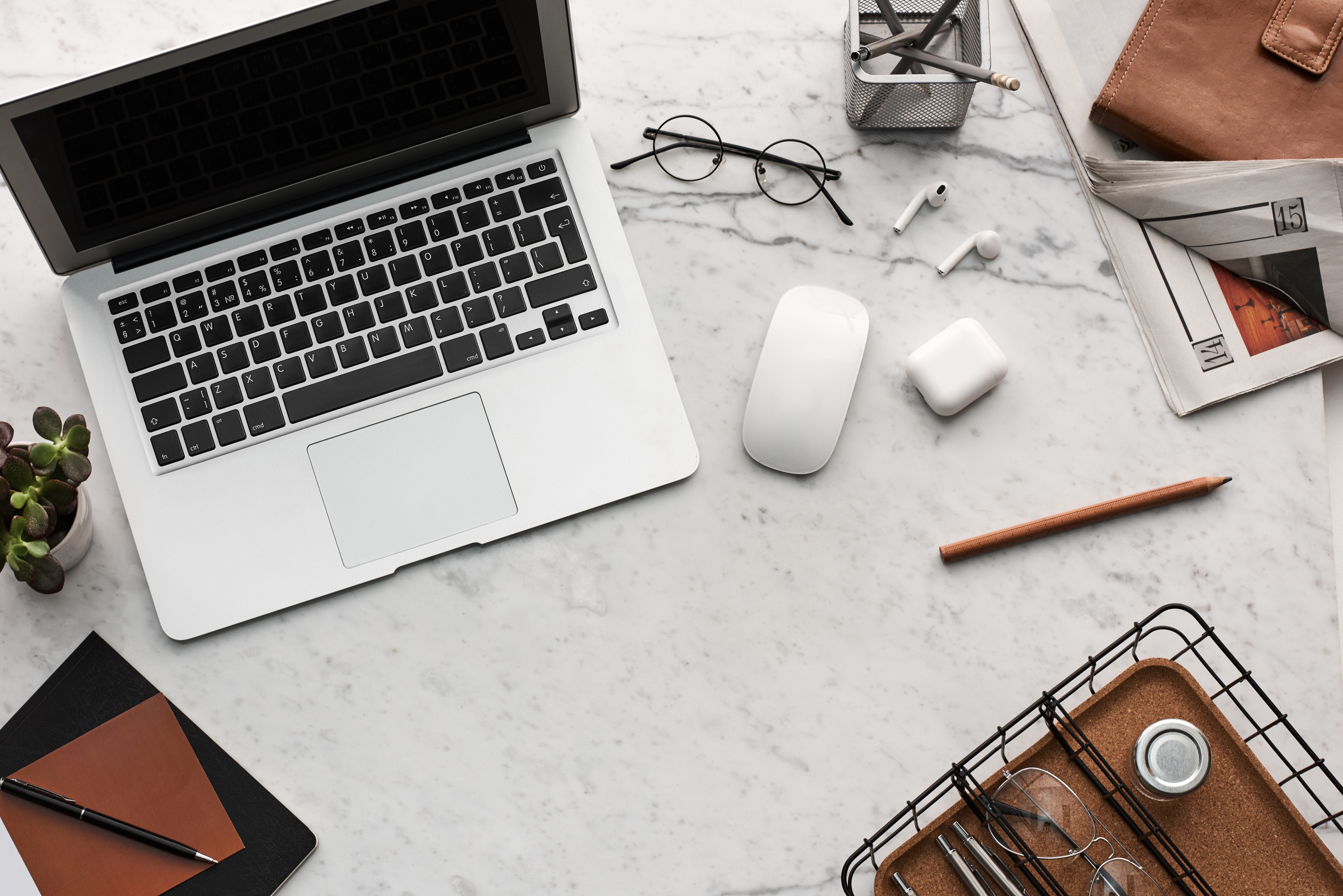 grey laptop on grey desk