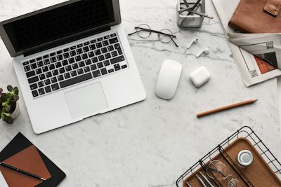 grey laptop on grey desk