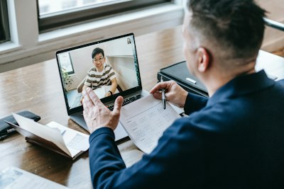 Man video conferencing on his laptop in the office