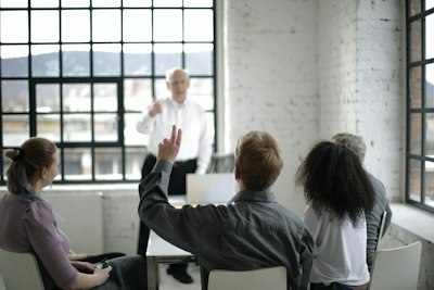 raising a hand to ask a question