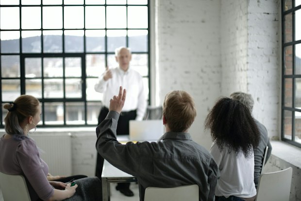raising a hand to ask a question