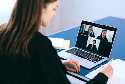 Woman in a secure video conference with her remote team