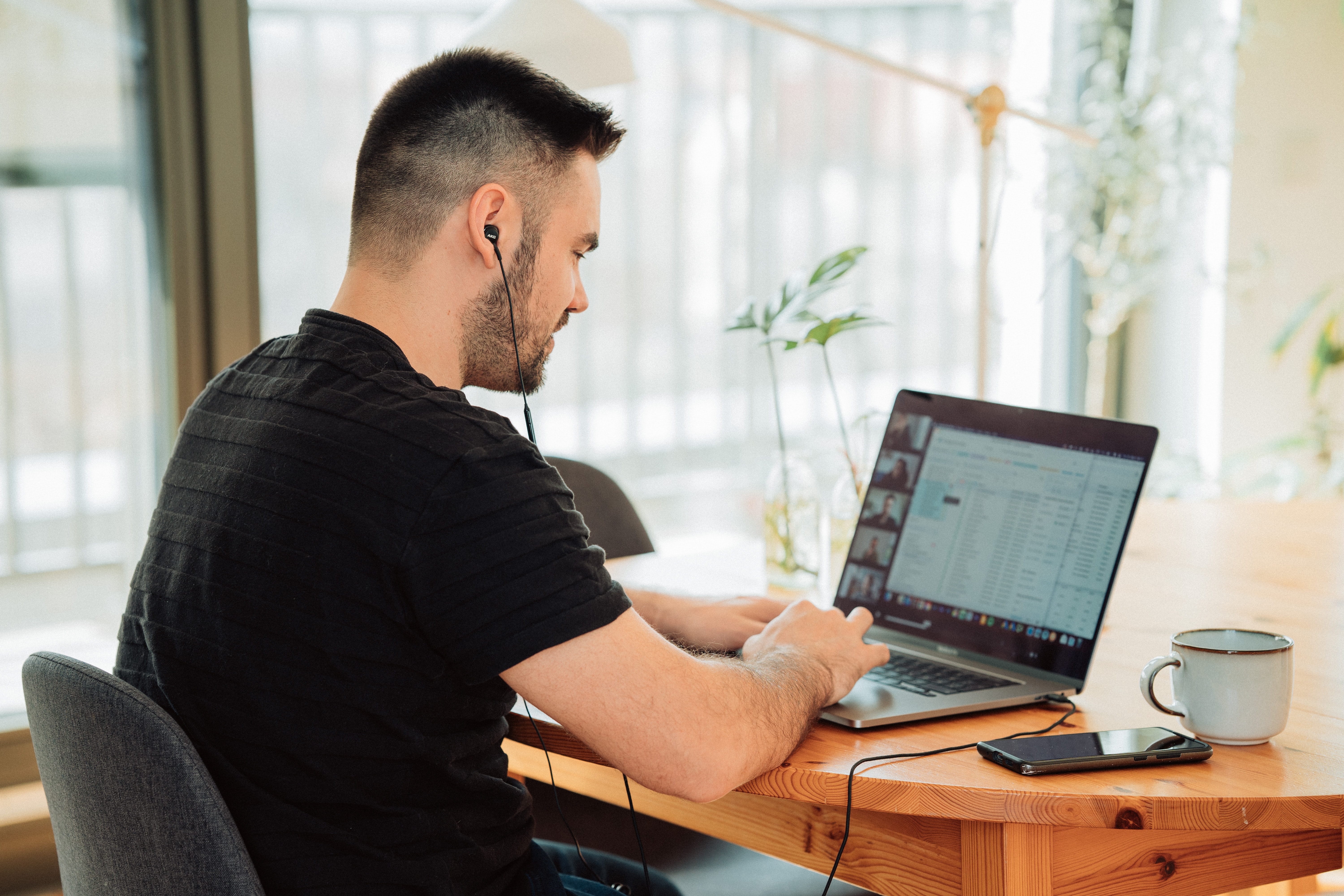 man participating in virtual improv class with team and clients on project