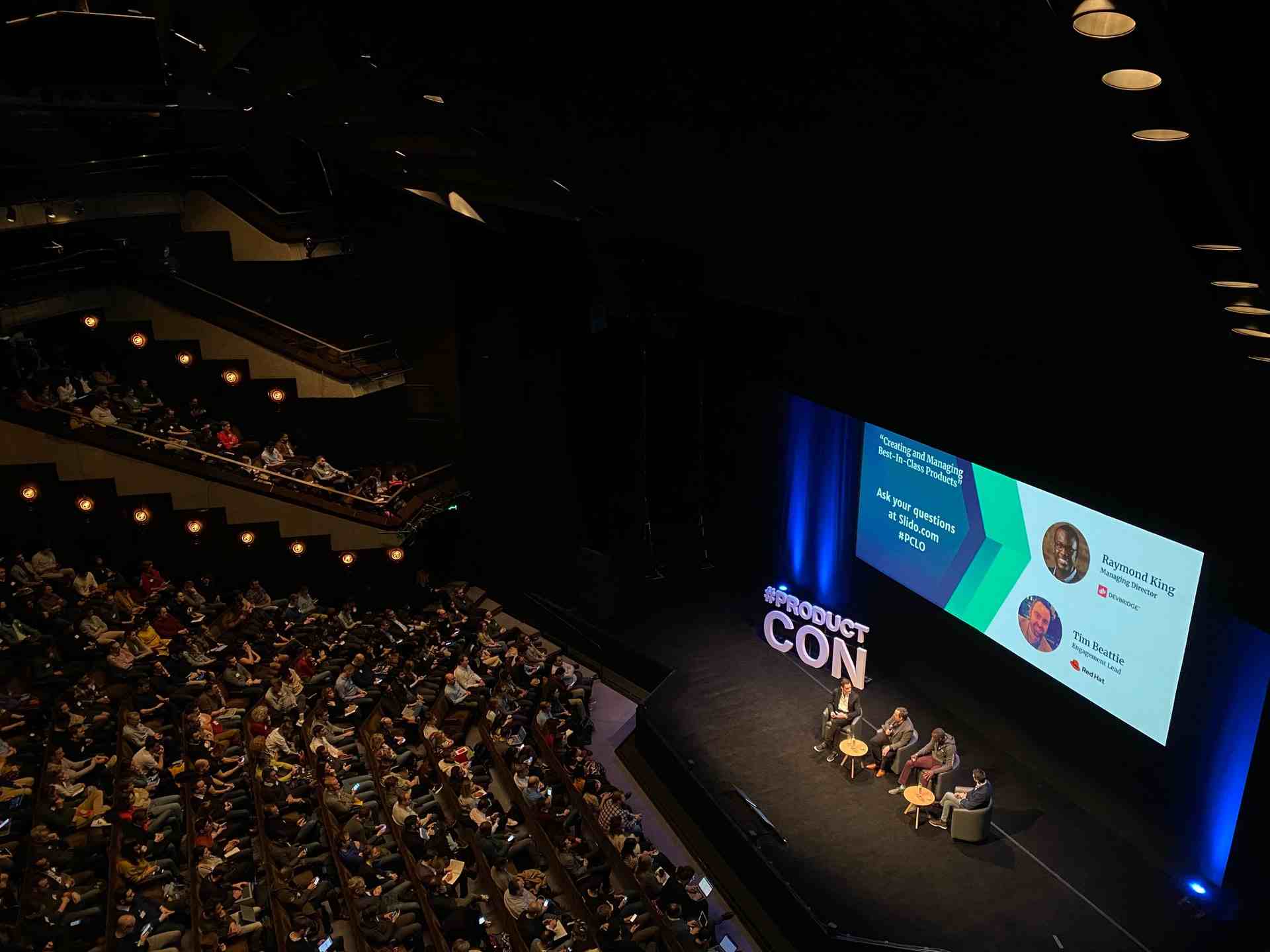 Panel discussion being hosted in an auditorium