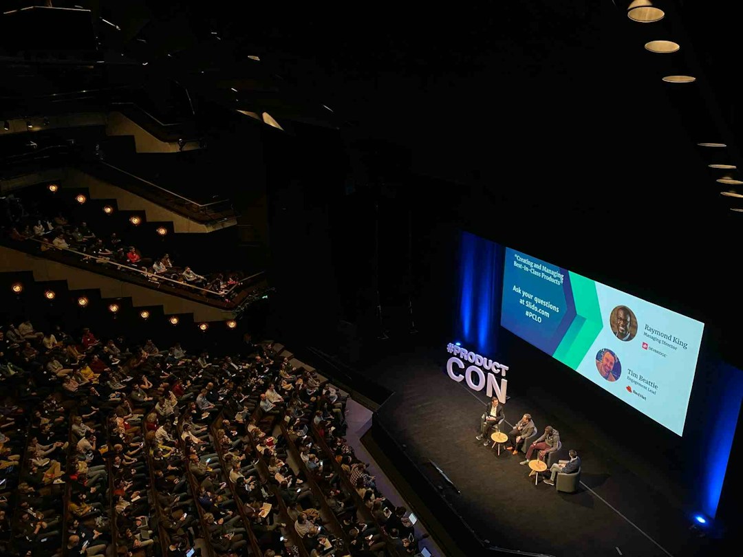 Panel discussion being hosted in an auditorium