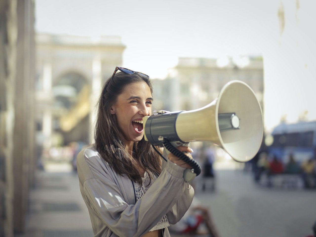woman with megaphone communication in the workplace