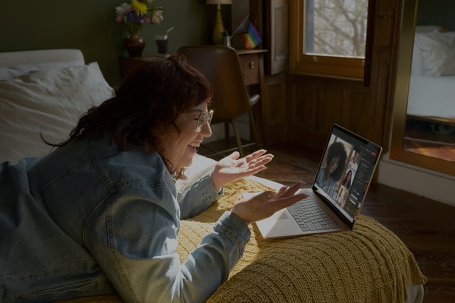 A woman attending an engaging webinar