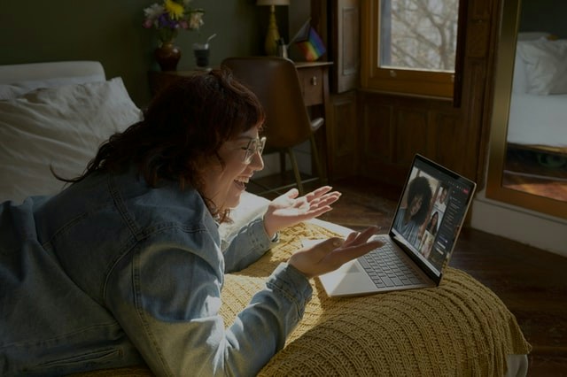 A woman attending an engaging webinar