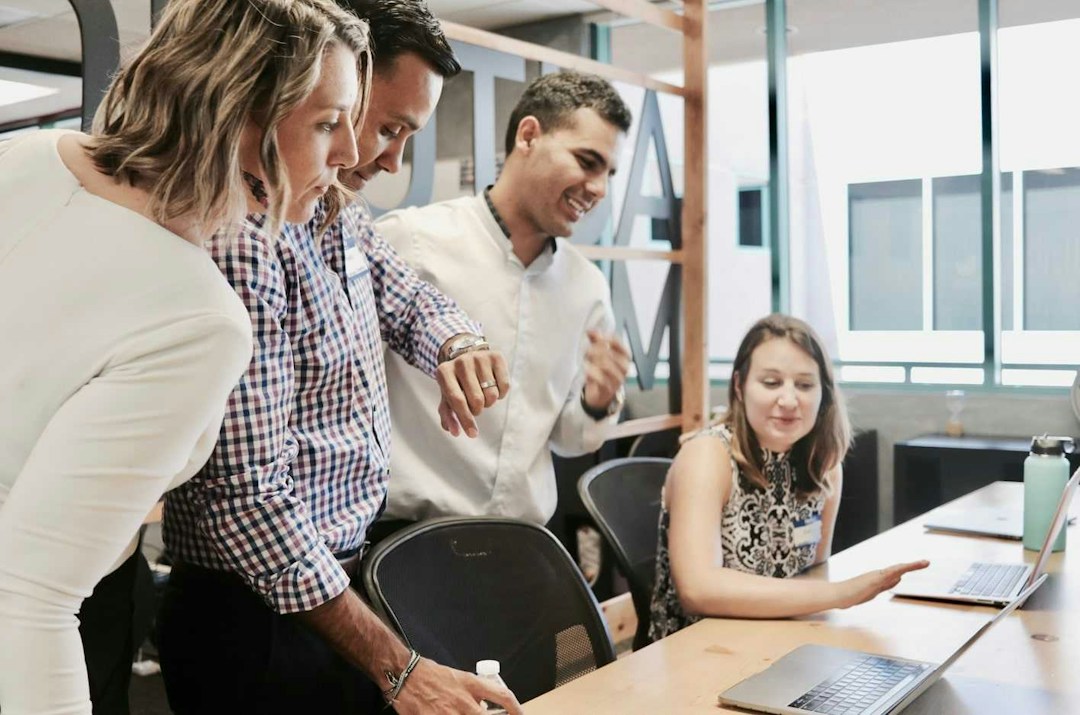 Employees gathering for a daily team stand-up meeting