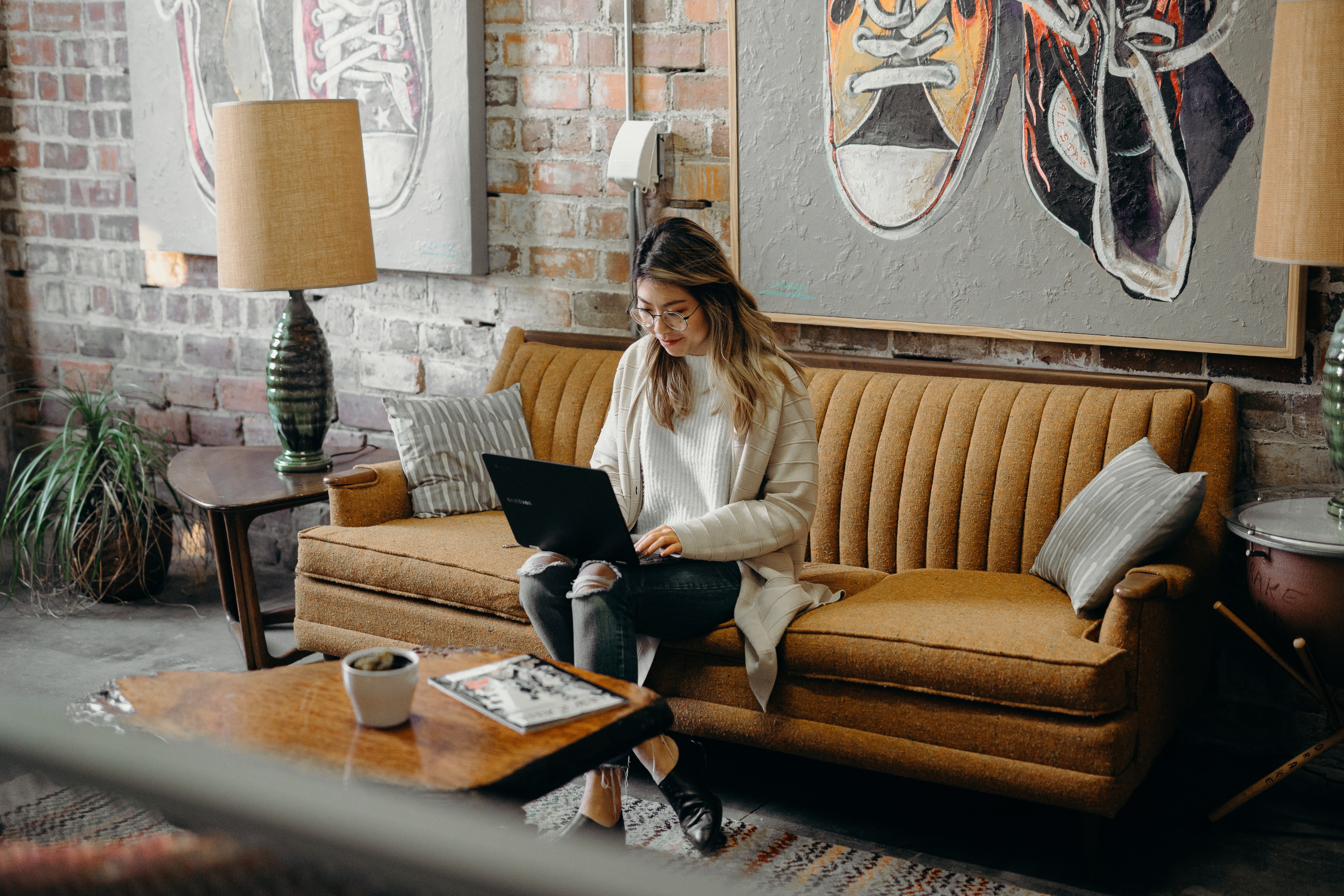 Woman writing webinar follow-up emails on her laptop