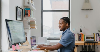 demand generation professional working at a computer