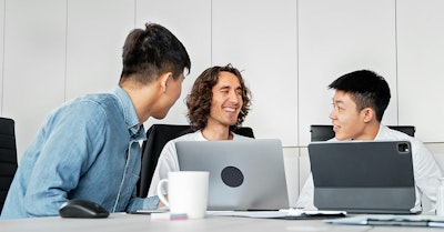 marketing team discussing demand generation tactics