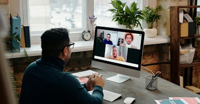 man attending a virtual medical conference