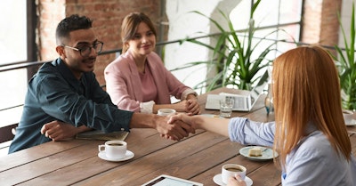 colleagues discussing event sponsorship