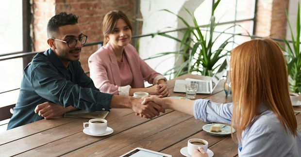 colleagues discussing event sponsorship