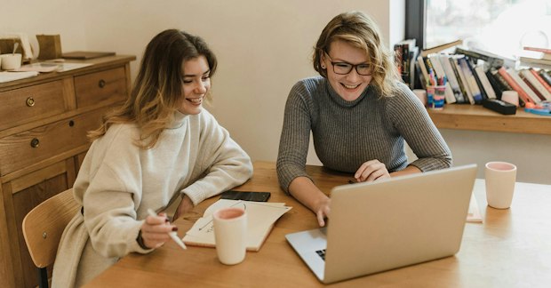 two colleagues attending a webinar
