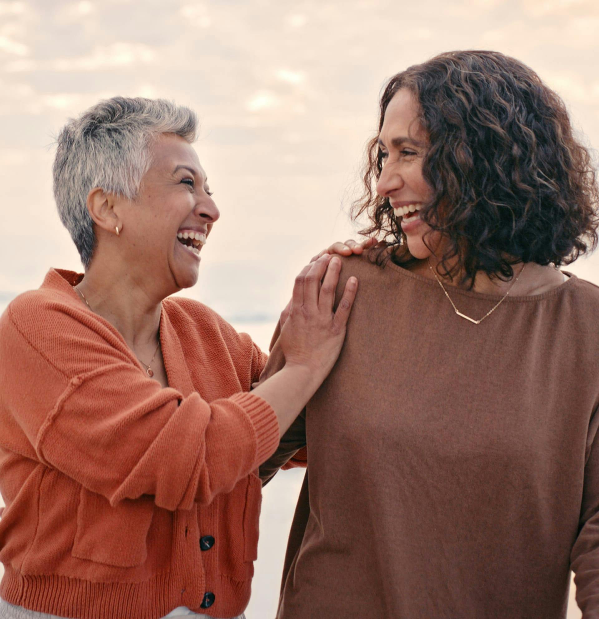 a woman with an older woman smiliing
