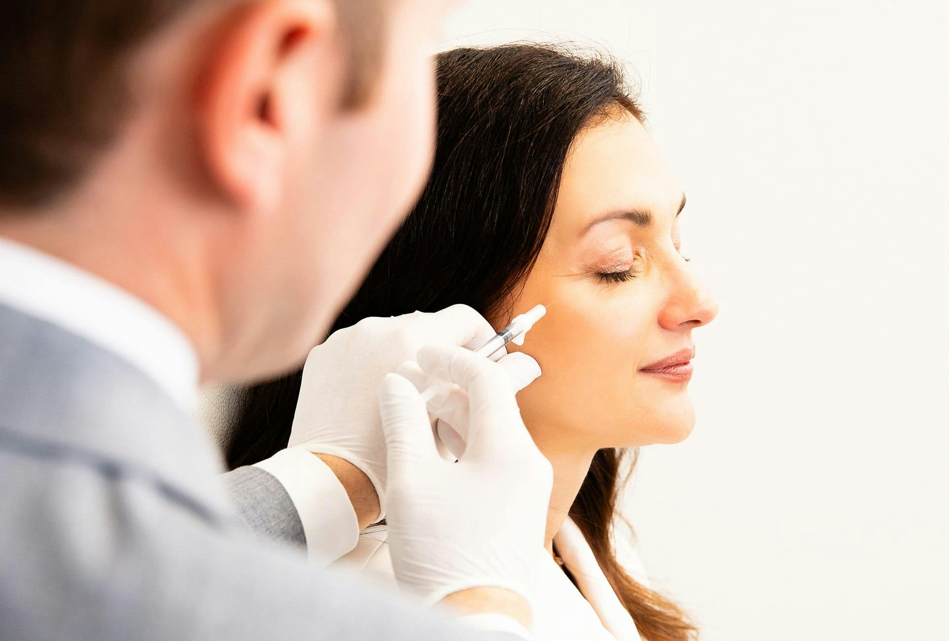 Woman getting facial injections