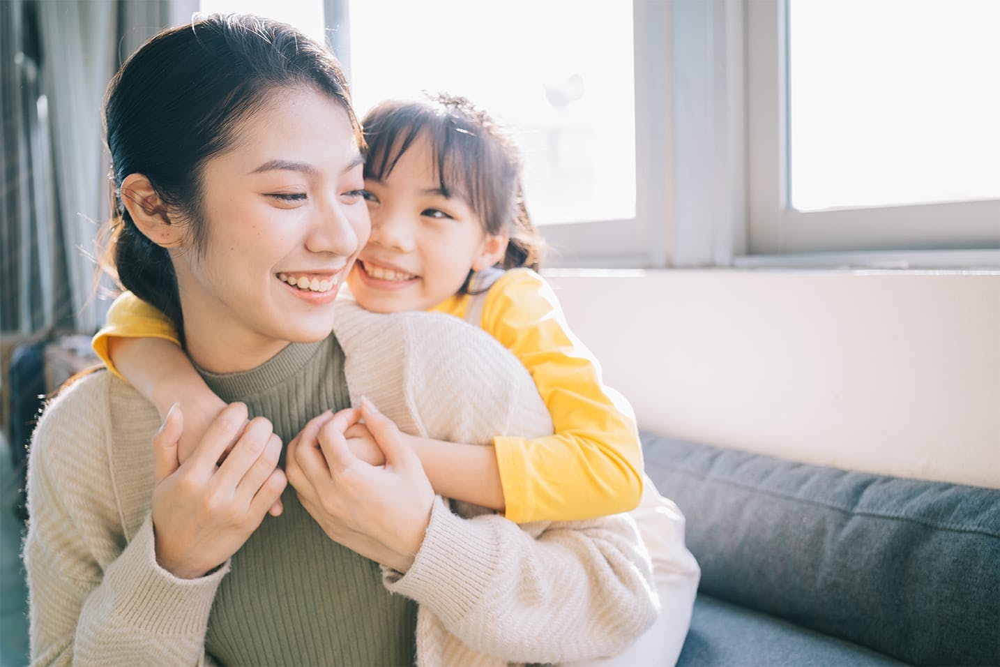 mother holding son in arms