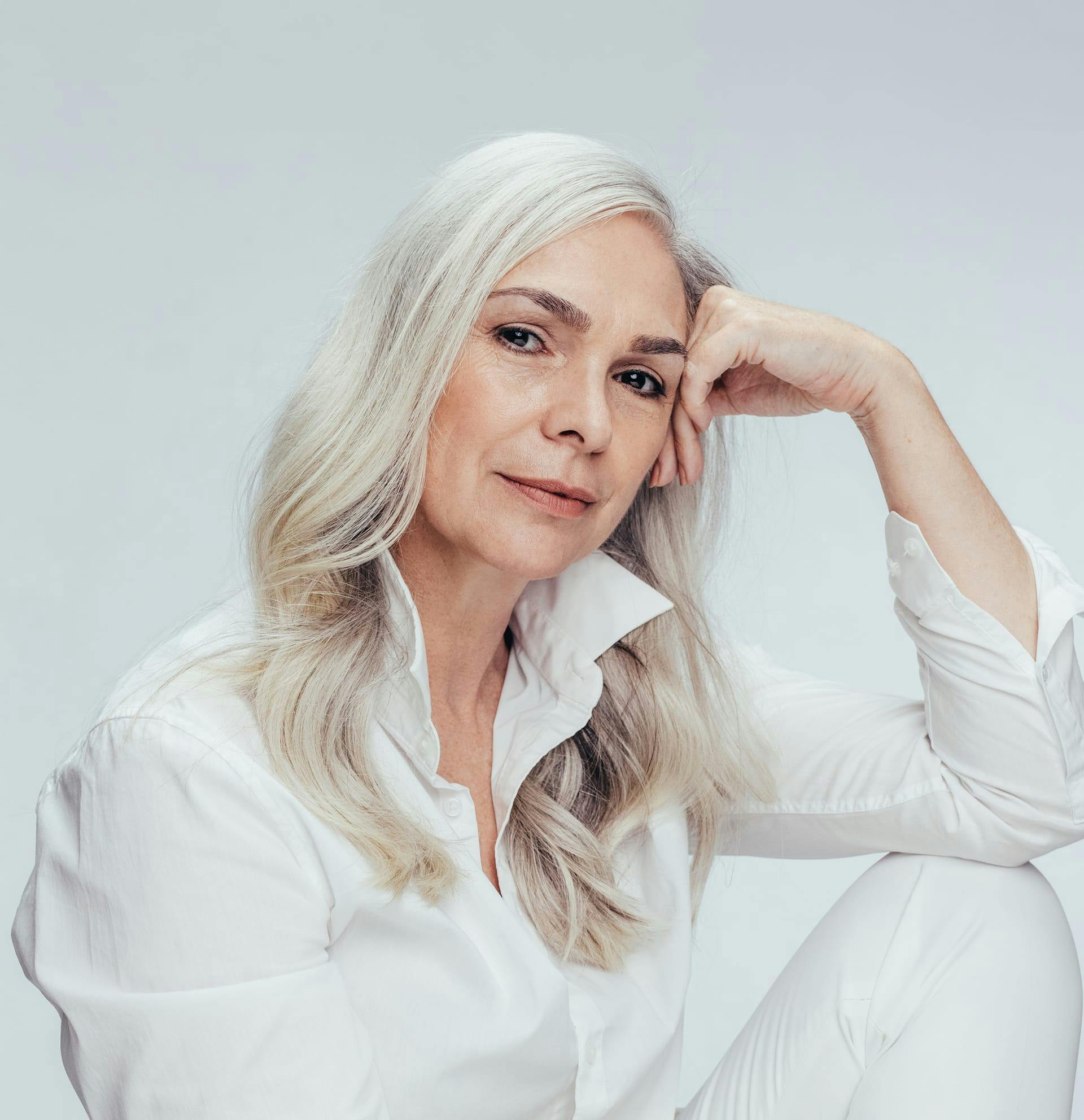 woman resting chin on her hand
