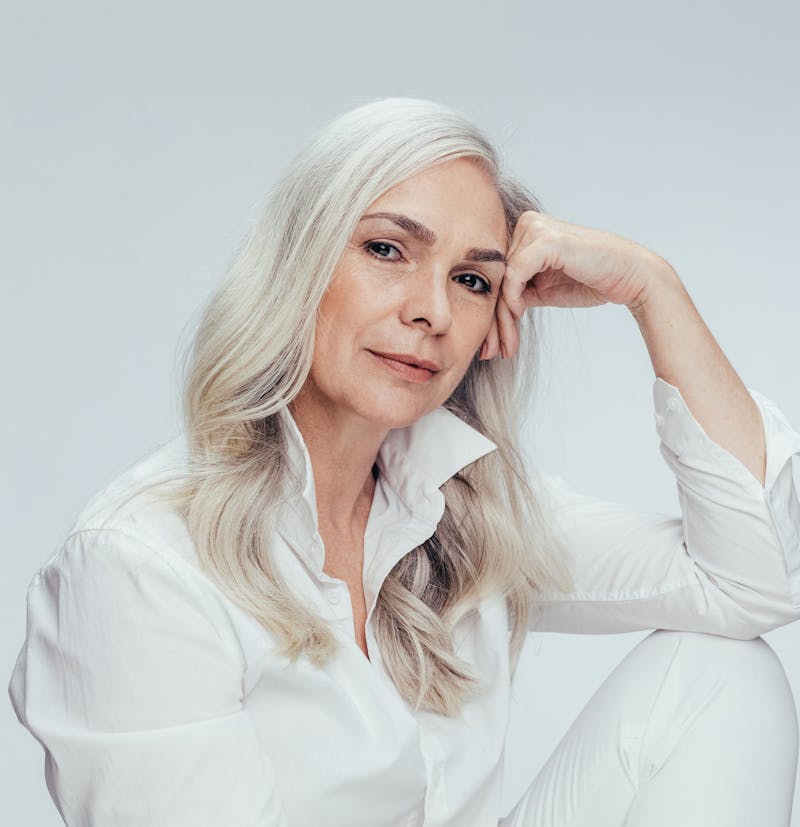 woman resting chin on her hand