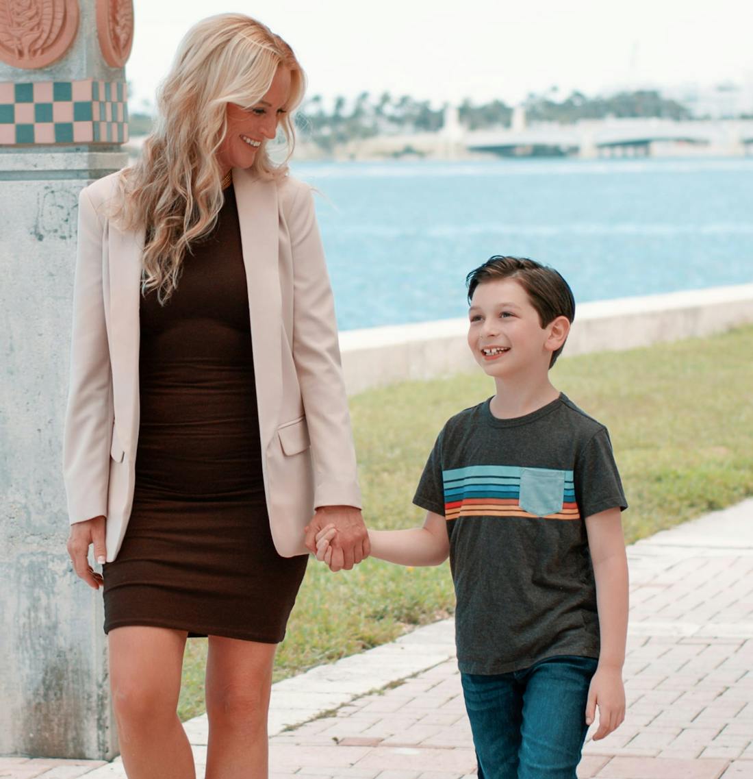 Woman walking with a little boy