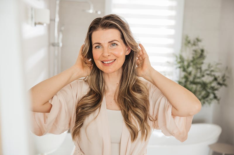 Woman fixing her hair