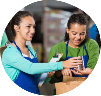 Two students filling bags.