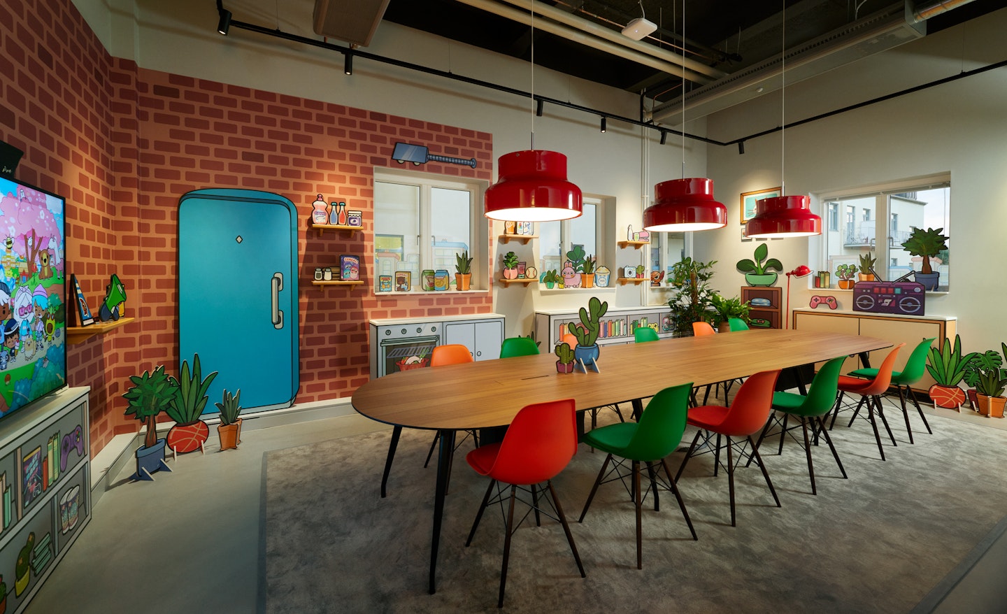 This is a photo of a meeting room from Toca Boca Campus. The room's art is designed to look like an apartment from Toca Boca World and there is large cardboard game assets on the wall