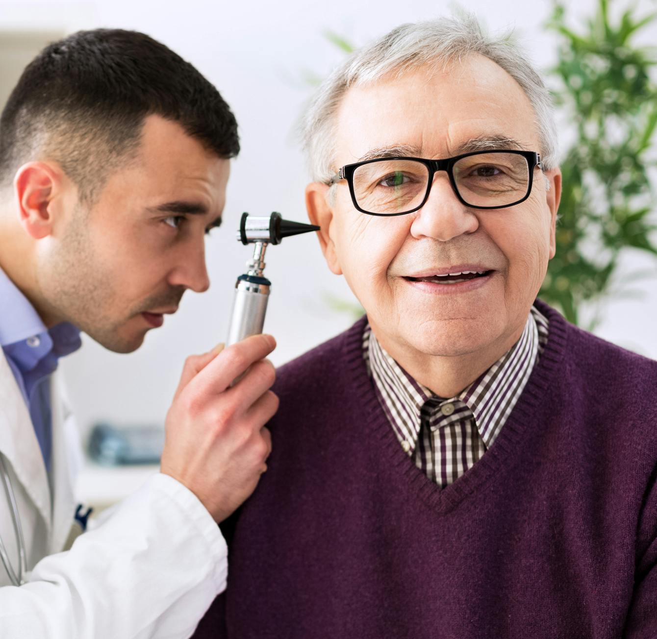 Doctor looking into a patient's ear