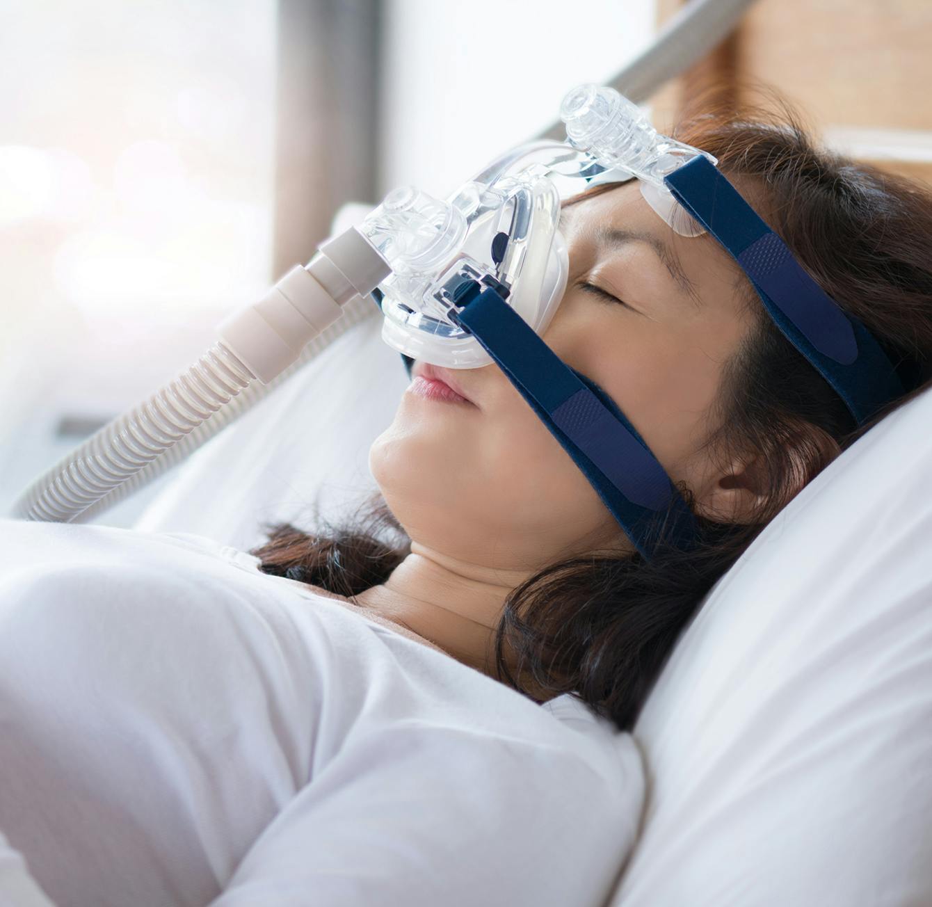 person using a sleep apnea machine