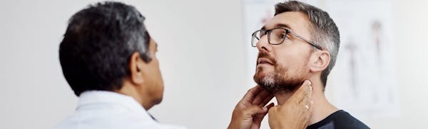 man being examined by a doctor