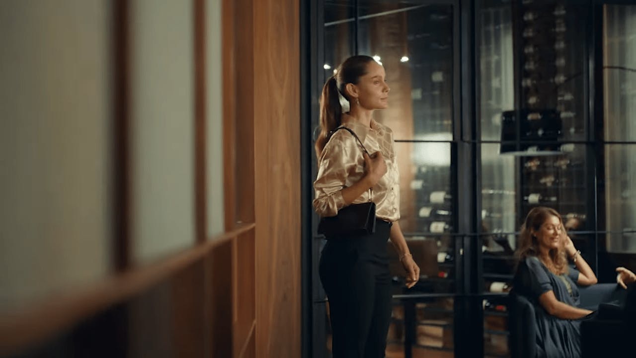 woman walking into a room