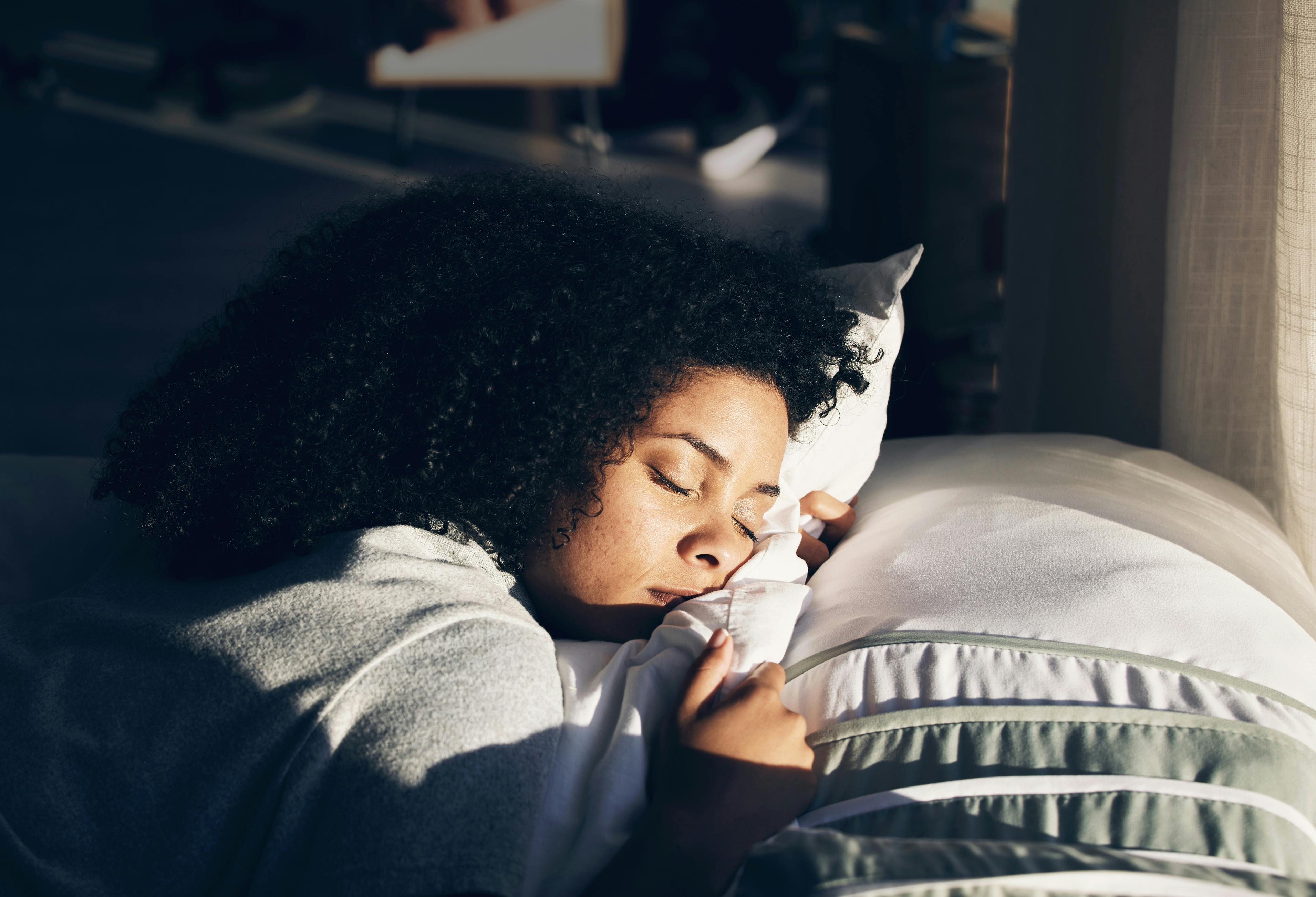 woman sleeping on a pillow