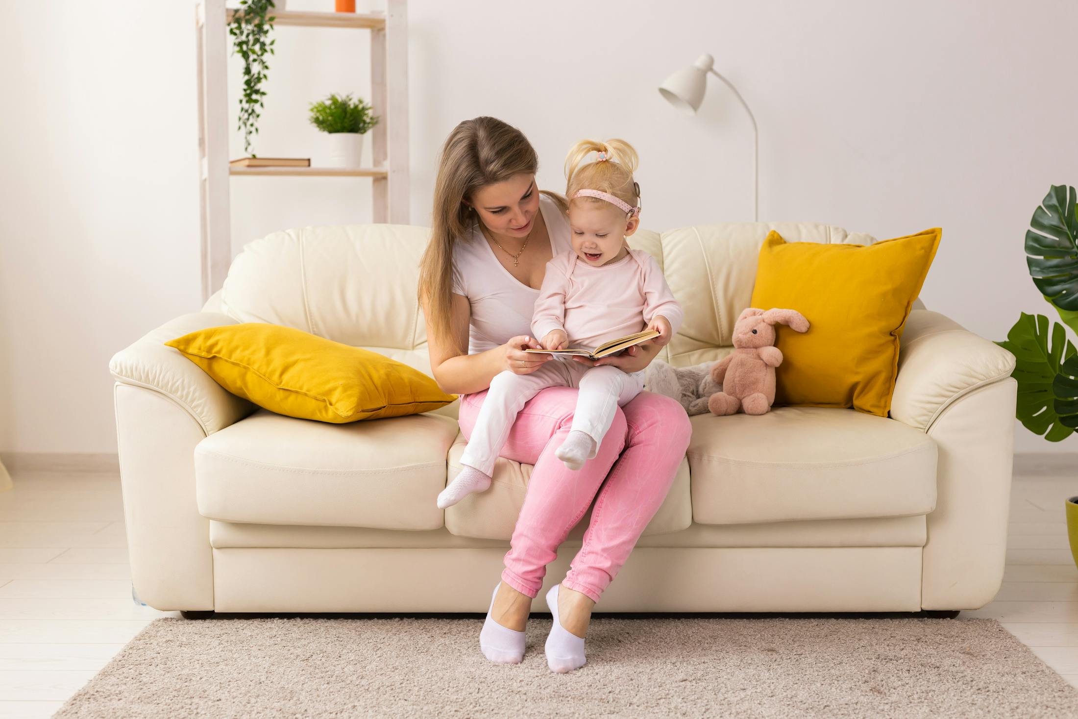 little girl sitting with her mom