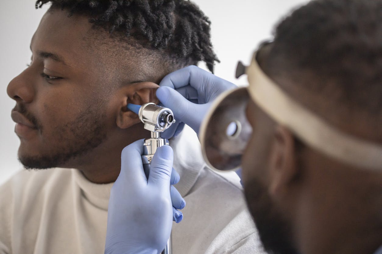 man getting his ear checked out