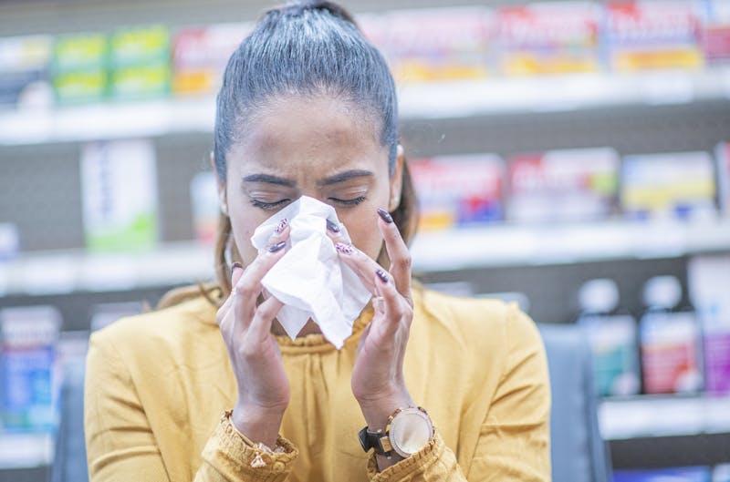 woman blowing her nose