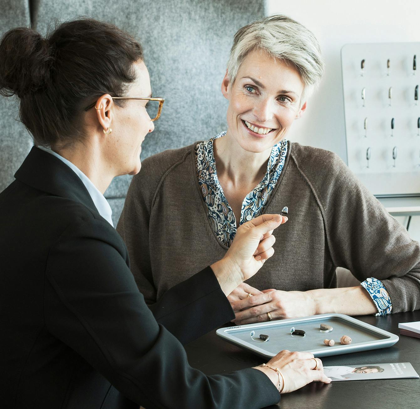 doctor and patient speaking about hearing aids